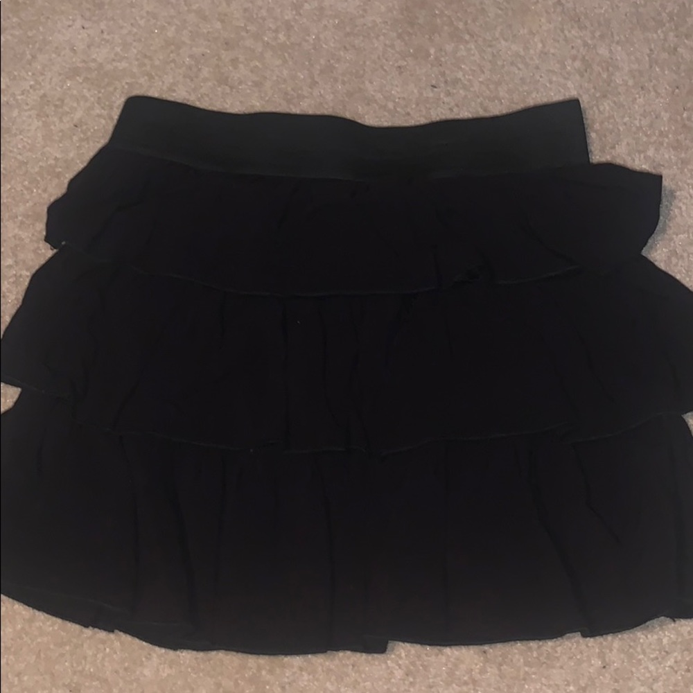Black ruffled mini skirt